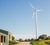 Wind turbine in a blue sky on a Cabot dairy farm in Vermont.