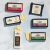 Cabot Aged Cheddar Cheese bars on marble counter and cutting board, with cheese sliced