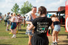 Girl wearing a Boldest Cheddar on the Block tee handing out Cabot cheese