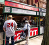 Cabot Concession Stand serving Grilled Cheese on Jersey st. at Fenway Park with people standing out front