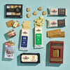 Vermont Maple Gift Box with cheese, maple syrup, crackers on blue background