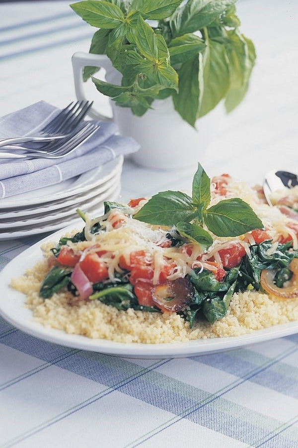 Couscous with Tomatoes, Sautéed Spinach & Two Cheeses