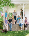 The Cabot farm family, Barstow's are posing together on the farmhouse front porch.