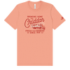 The Bringing Home the Cheddar T-shirt by New Duds features peach ultra-soft jersey, red text, a vintage truck graphic, and "Bringing Home The Cheddar"—with a Cabot Creamery sleeve logo and Vermont pride since 1919.