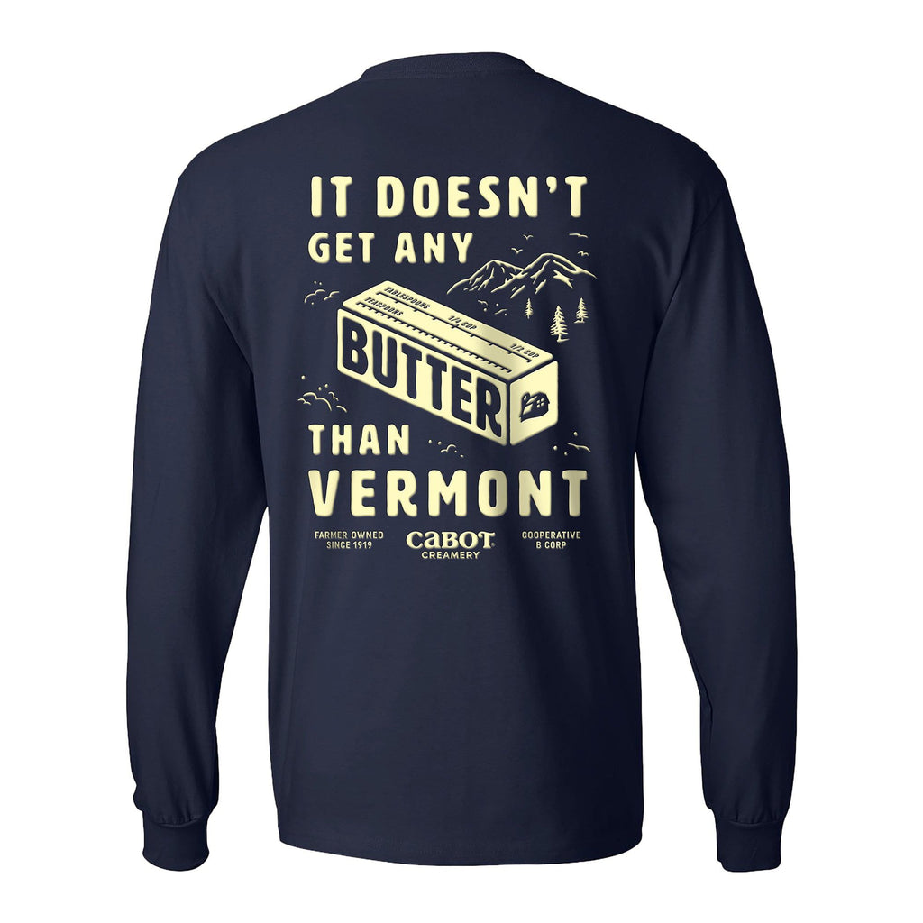 The Butter Long Sleeve T-shirt by New Duds is a navy heavyweight tee made from 100% ring-spun cotton, featuring a yellow butter stick and mountain graphic with “It doesn’t get any butter than Vermont” celebrating Cabot Creamery’s heritage.