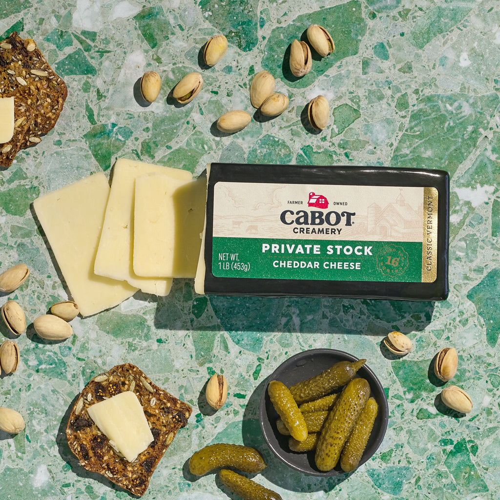 Private Stock Cheddar Cheese 1lb with pistachios, pickles and crackers