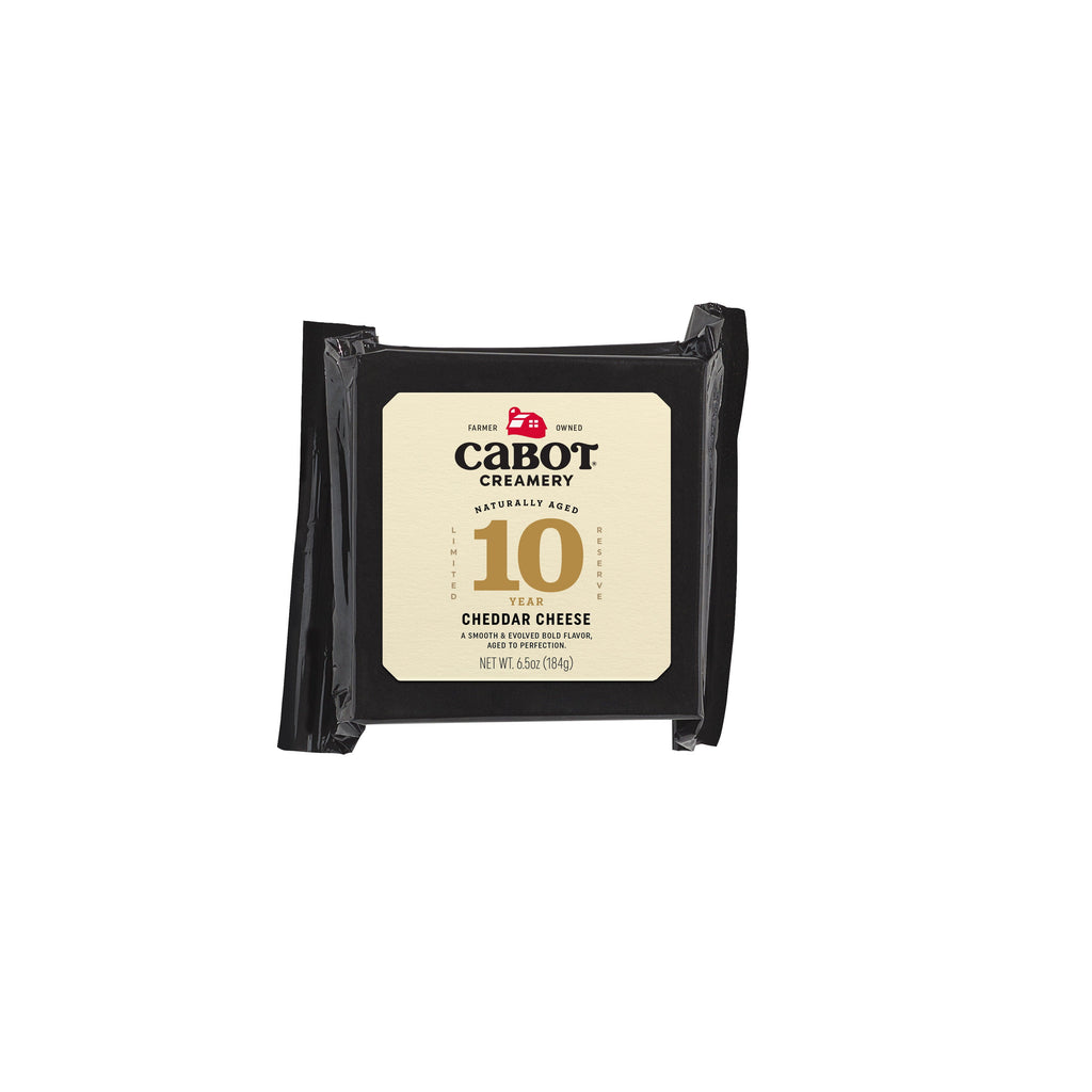A 6.5-ounce block of Cabot Creamerys super-premium cheddar, wrapped in black with a cream label and 10 Year in gold, offers a nutty sweetness and tangy bite, ideal for cheese aficionados.