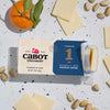 Cabot Creamery cheese packaging with cheese slices and pistachios on a speckled surface