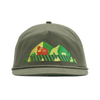 The Fresh From Vermont 90s Roper Hat by New Duds is an olive green cap featuring an embroidered design of yellow and green mountains, green trees, and a red cabin, complete with a braided rope detail above the brim.