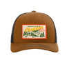 The New Duds Where Life is Cheddar Trucker Hat is a brown and black snapback with an adjustable fit, featuring a patch that reads “Where Life Is Cheddar Vermont USA” along with a rural landscape illustration of trees and a barn.