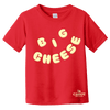 A red Big Cheese Toddler T-shirt by New Duds, featuring the words “BIG CHEESE” in bold, yellow, puffy letters and a small Cabot Creamery logo in the bottom right corner, crafted from soft ringspun cotton for comfort and durability.