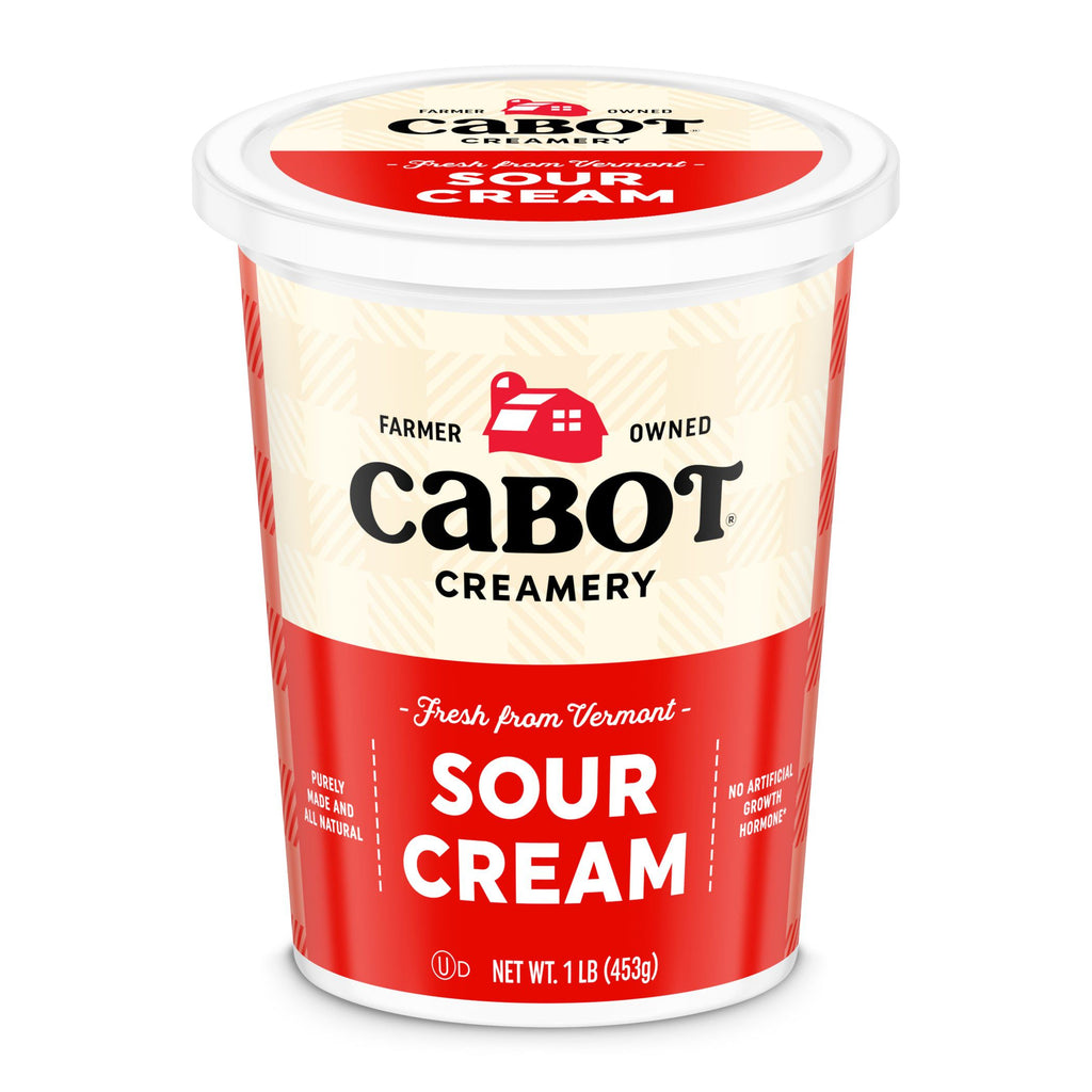 A 1-pound Cabot Creamery Sour Cream, featuring a red and cream label with Farmer Owned, Fresh from Vermont, and No Artificial Growth Hormones—a creamy kitchen staple.