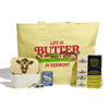 Introducing the Butter Lover’s Gift Box by Cabot Creamery: a vibrant yellow tote bag with “Life is Butter in Vermont” printed on it, accompanied by Cabot premium butter packages, a delightful cow-themed butter dish, a whimsical butter pin, and a Vermont-inspired butter magnet—making it the perfect gift set for any true butter enthusiast.