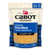 A bag of Cabot Creamery Extra Sharp Yellow Cheddar Cheese, shredded classic cut. The front label notes it's farmer-owned, 8 oz (226g), premium naturally aged extra sharp cheddar, and contains 0g lactose per serving.