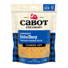 A package of Cabot Creamery Extra Sharp Yellow Cheddar Cheese, classic cut, 8 oz. The blue and beige bag displays shredded cheese through a clear window, highlighting the bold taste of extra sharp yellow cheddar.
