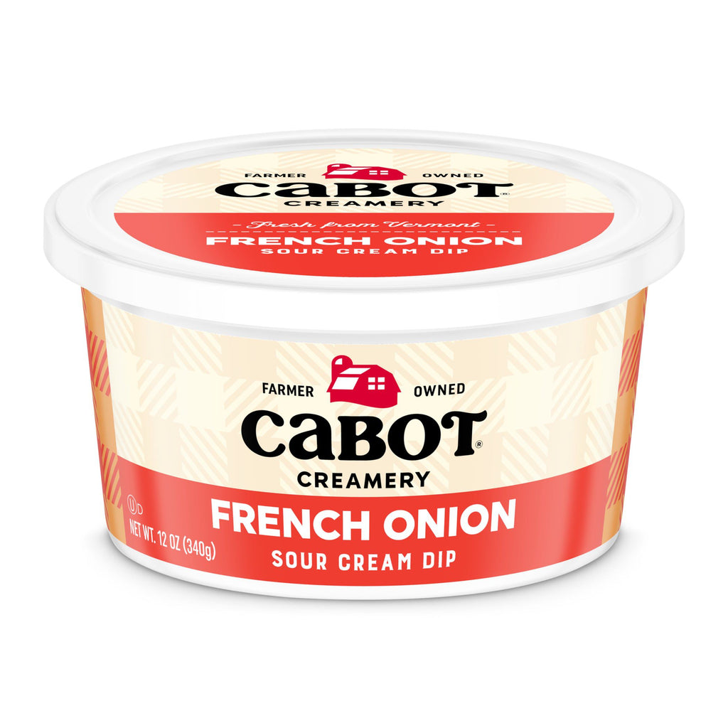 A 12-ounce container of Cabot Creamery French Onion Dip, made with rich sour cream. The red and beige label displays the Cabot logo and farmhouse graphic on the lid and front.