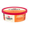 A round container of Cabot Creamery Garden Vegetable Cream Cheese, 8 oz, with a red lid, orange and cream plaid accents, and the Cabot logo on the label.