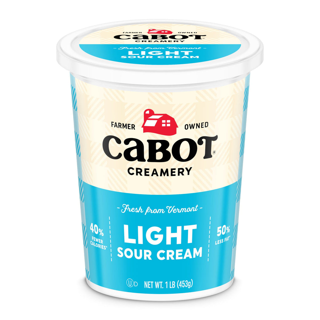 A 1-pound container of Cabot Creamery Lite Sour Cream features a blue and white label with the Cabot logo, product name, and claims of 40% fewer calories, 50% less fat, and a creamy taste in every serving.