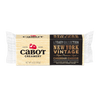 A 6-ounce block of Cabot Creamery New York Vintage Cheddar Cheese, a lactose-free cheddar from the Legacy Collection, in beige and black packaging with red and gold accents and descriptive text.