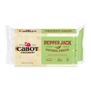 A 2-pound block of Cabot Creamery Pepper Jack Cheese comes in green and white packaging, labeled as seasoned, premium, creamy, and lactose-free with a mild-to-hot heat scale. Ideal for spice lovers and perfect for nachos.