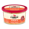A 7-ounce Cabot Creamery Pimento Cheese Spread features a red lid, Vermont cheddar on the label, orange accents, cheese imagery, and classic spread branding.
