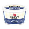 A container of Cabot Creamery Whipped Salted Butter, made from fresh cream, features a blue and cream plaid design, the Cabot logo with a red barn, and text noting it has 36% less fat than regular spreadable butter.