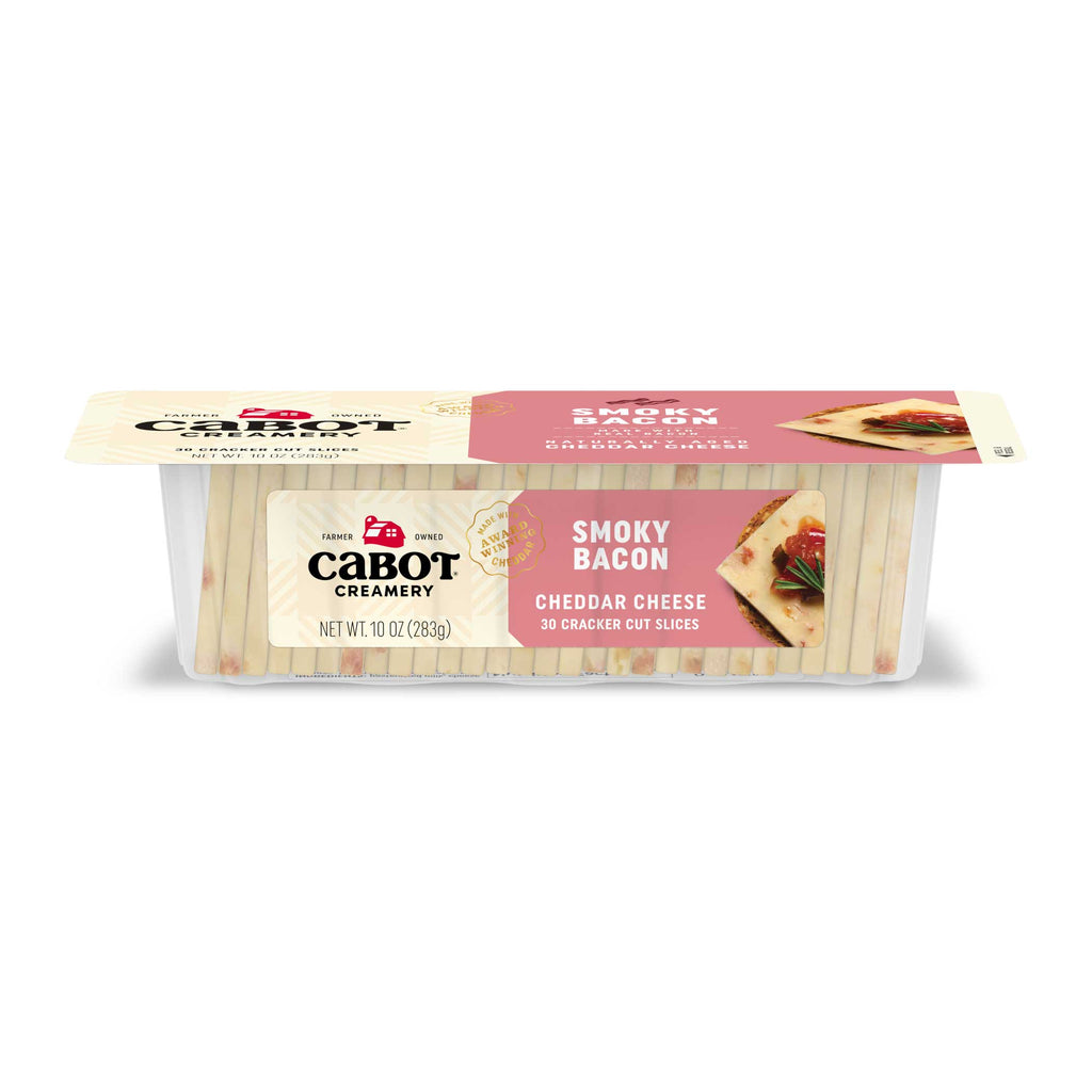 A 10 oz package of Cabot Creamery Smoky Bacon Cheddar Cheese, featuring lactose- and gluten-free slices in a clear container with a pink label showing cheese-topped crackers.