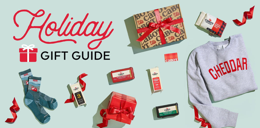 Holiday gift guide with various items including a sweater, socks, and boxes on a light blue background.