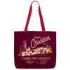 The Making the Cheddar Canvas Tote by New Duds is a sturdy maroon tote with red handles, featuring Cabot Creamery’s “Making the Cheddar Since 1919” illustration and celebrating farmer-owned co-op pride.