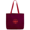 The Making the Cheddar Canvas Tote by New Duds is a sturdy maroon bag with red handles, featuring an orange Cabot Creamery logo and the message: From our cooperative of farm families, Cabot Creamery. Show your co-op pride!.