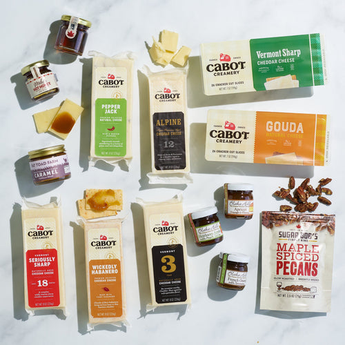 The Cheese Pairing Collection by Cabot Creamery features award-winning cheeses, jam, caramel, and maple spiced pecans—all arranged for perfect gourmet pairings.