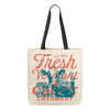 The Fresh From Vermont Canvas Tote by New Duds features an iconic cow graphic and black handles, adorned with vintage Fresh Vermont and Cabot Creamery est. 1919 text. It showcases red and blue shades on a beige canvas, celebrating the spirit of family-owned farms.