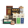 The Vermont Maple & Cheese Gift Box by Cabot Creamery features Vermont-made crackers, maple syrup, caramel sauce, and assorted Cabot cheeses—artfully arranged on a white background. A delicious gift for any foodie.