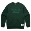 The Vermont Sharp Chainstitched Crewneck by New Duds is a dark green, relaxed-fit sweatshirt featuring light green "Vermont Sharp" chain-stitching on the front and a Cabot Creamery patch. Made with recycled plastic bottles for sustainability.