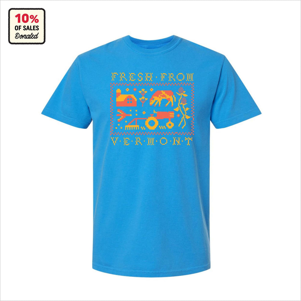 The Cabot x Always With Honor T-shirt by New Duds features bright blue fabric, pixel art and Fresh From Vermont, farm images, a Cabot ALWAYS WITH HONOR label, OEKO-TEX certification, and donates 10% of sales.
