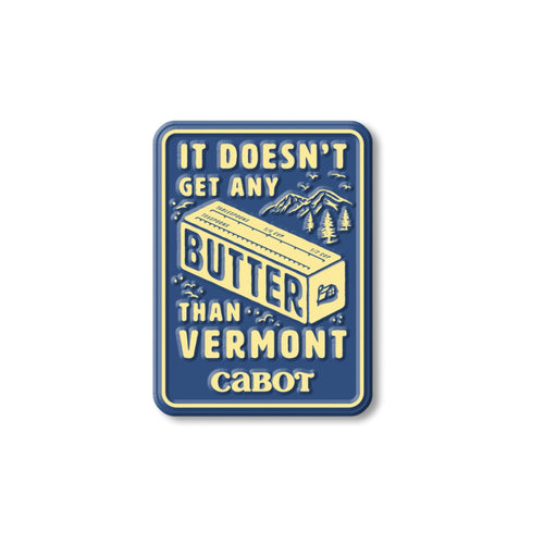 A blue and yellow Life is Butter Magnet by Idea Man, INC features a butter stick and the phrase “It doesn’t get any butter than Vermont Cabot,” with mountains and trees in the background.