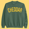 Cabot Cheddar Sweatshirt on yellow background