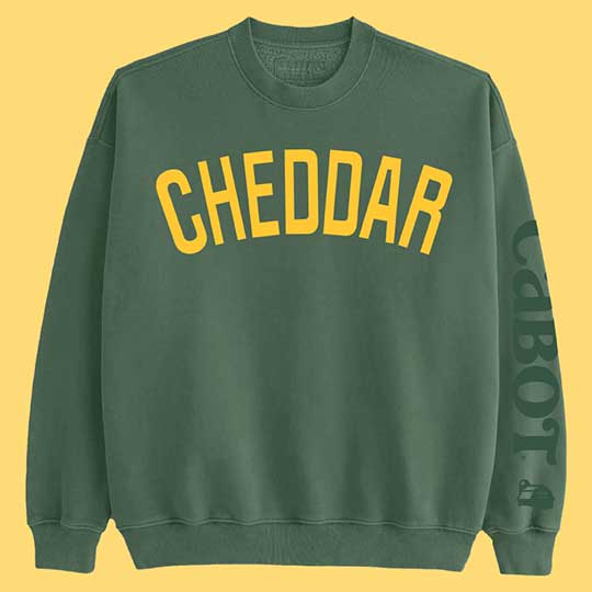 Cabot Cheddar Sweatshirt on yellow background