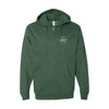 The Committed to Quality Zip Hoodie by Cabot Creamery, in dark green, is made from a soft cotton blend fleece with a hood and front pockets. It has a circular logo with an anchor and 1887 on the left chest, complemented by the Cabot Quality Seal.