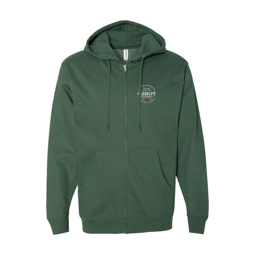 The Committed to Quality Zip Hoodie by Cabot Creamery, in dark green, is made from a soft cotton blend fleece with a hood and front pockets. It has a circular logo with an anchor and 1887 on the left chest, complemented by the Cabot Quality Seal.